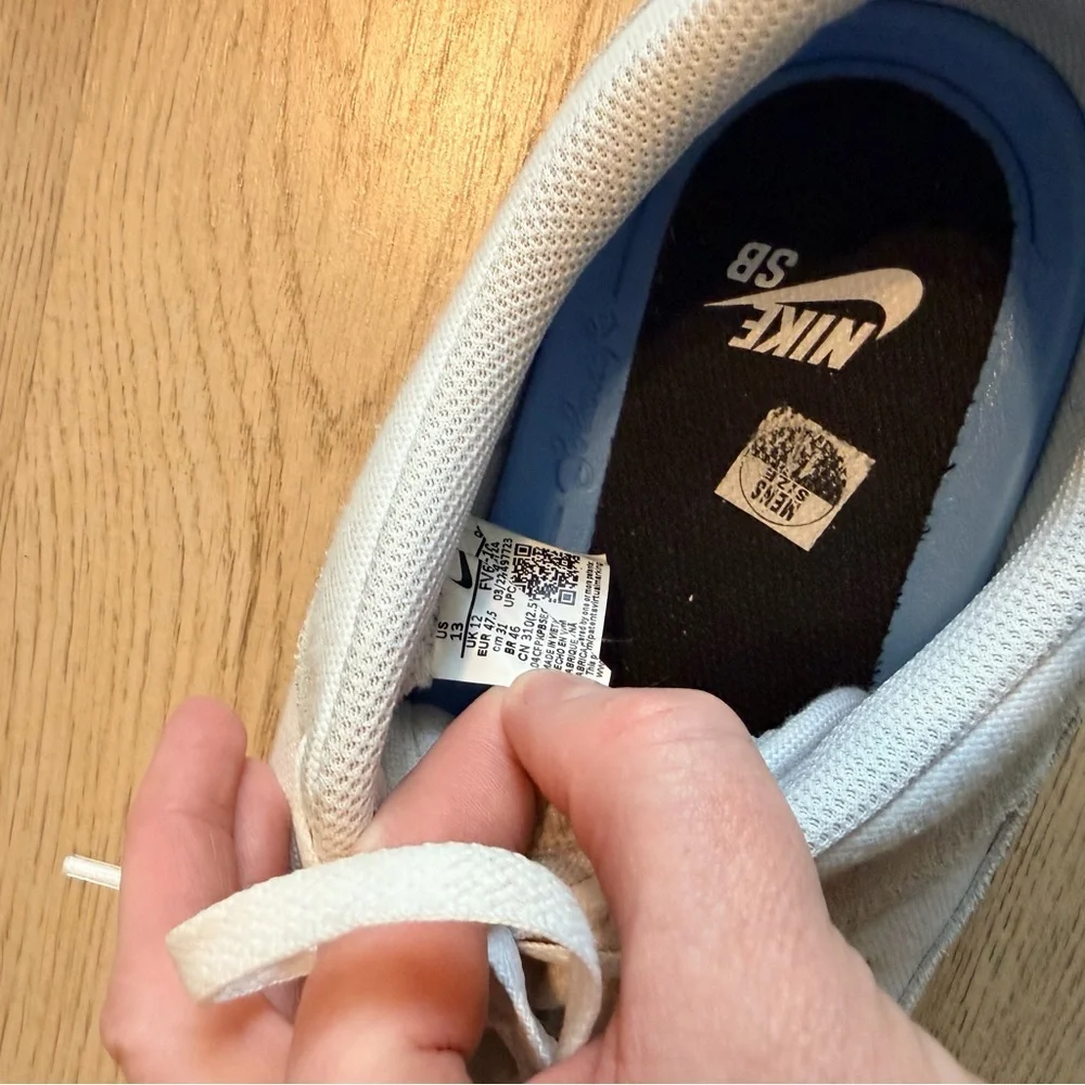 Nike Men's Off-White Sneakers with Black Swoosh